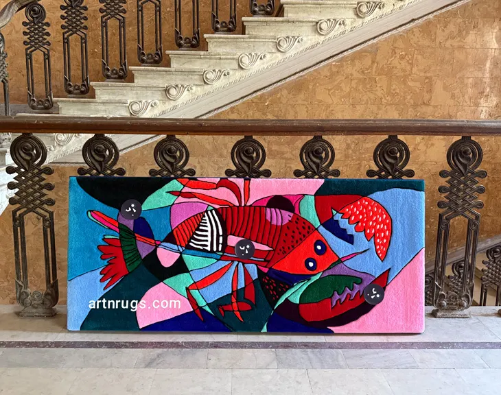 Cubist lobster wall rug displayed on a historic stone staircase.