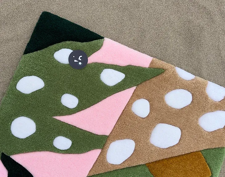 Close-up of abstract pink, olive, mustard and ivory leaf shapes.