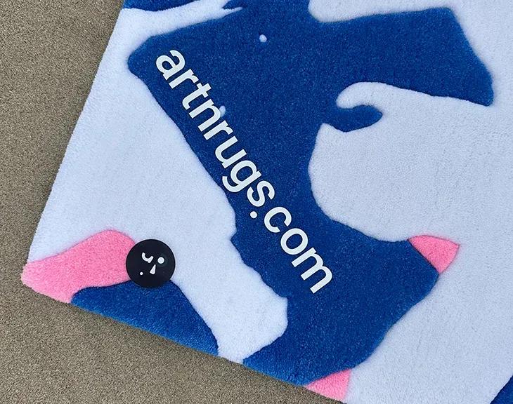 detail of edge and pile on Ksenia Derr's blue white pink hand-tufted abstract rug