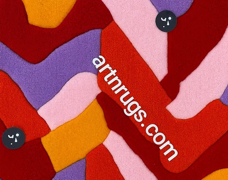 Close-up of interlocking red, orange, pink and purple blocks.