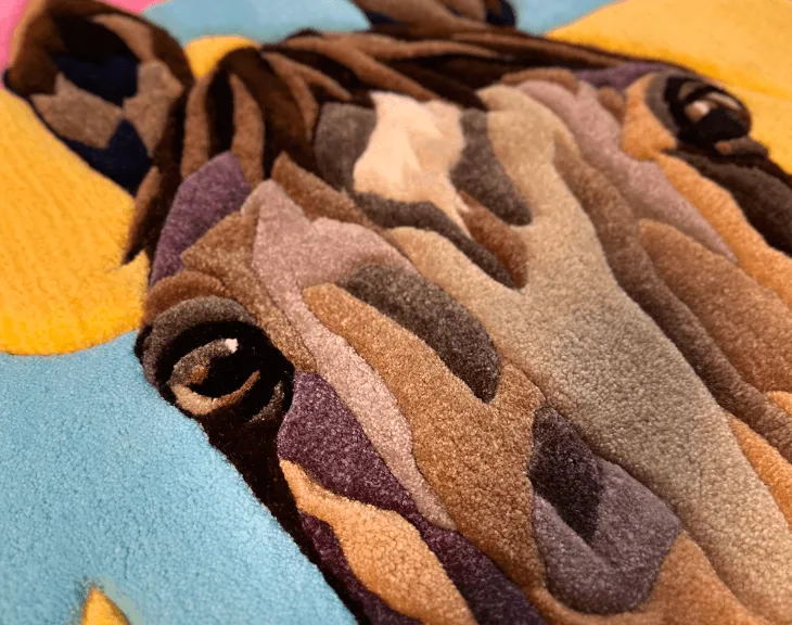 Close-up of the tufted horse eye and brown yarn markings.